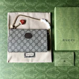 Gucci Mini Monogram Pouch with Strawberry Charm image 1