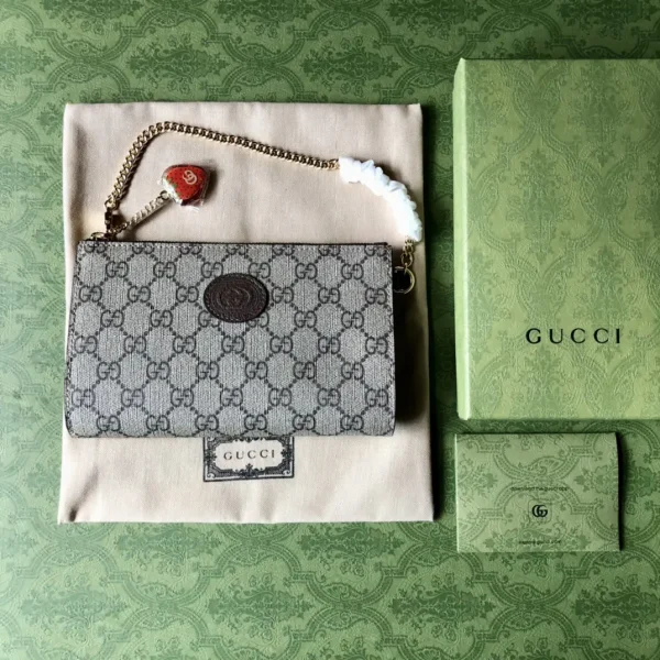 Gucci Mini Monogram Pouch with Strawberry Charm image 1