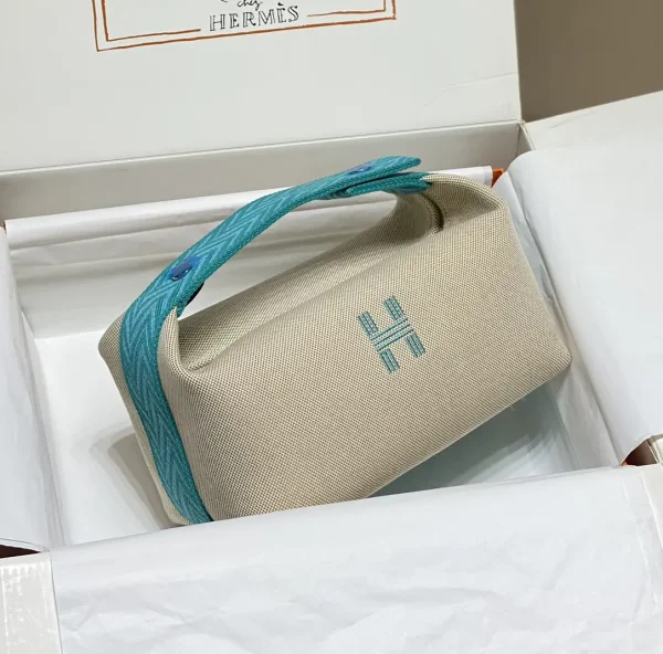 Hermès Canvas Toiletry Bag with Teal Handle image 1
