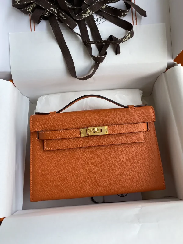 Hermès Orange Top Handle Clutch Bag image 1