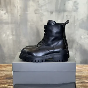 Balenciaga High-Top Distressed Leather Boots image 1