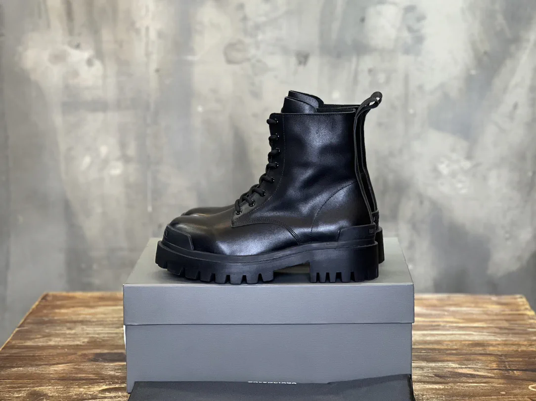 Balenciaga High-Top Distressed Leather Boots image 1