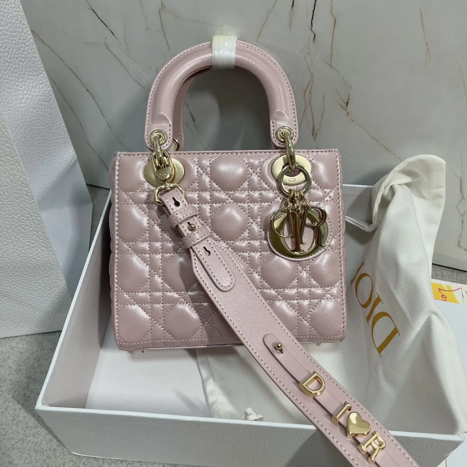 Dior Quilted Top Handle Bag with Decorative Shoulder Strap image 1