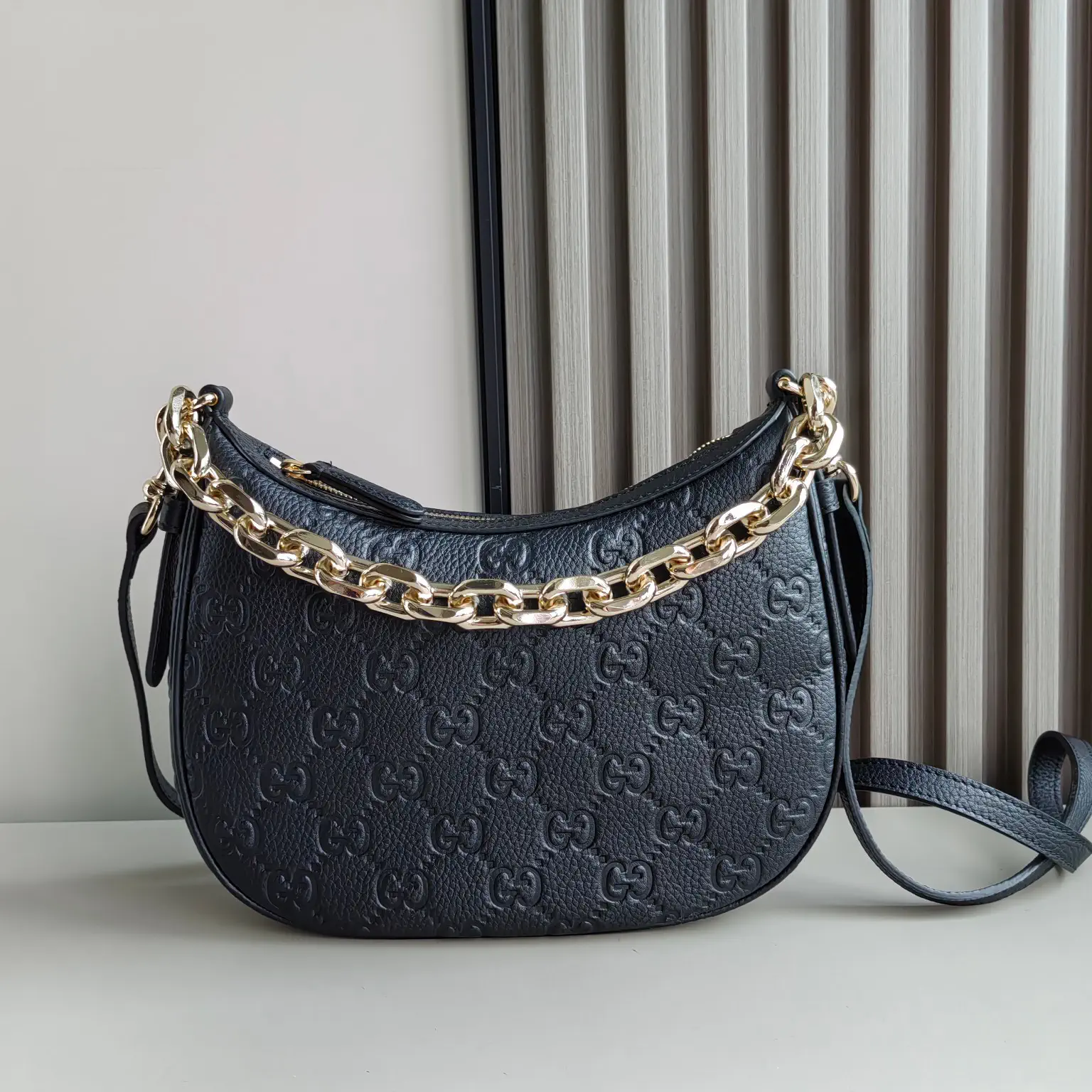 Gucci GG Emblem Small Half-Moon Crossbody Bag image 1