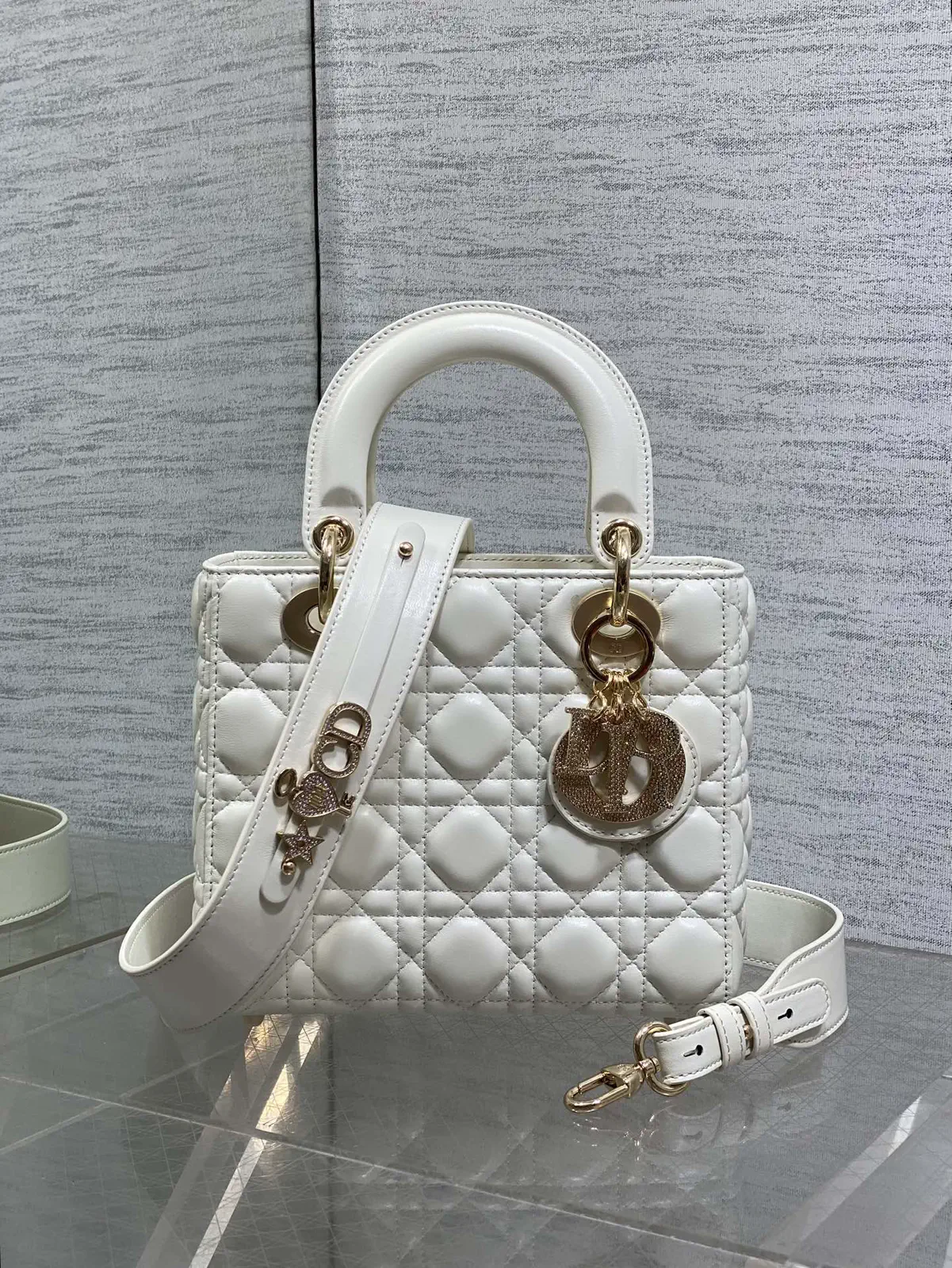 Dior Quilted Top Handle Bag with Decorative Charms image 1