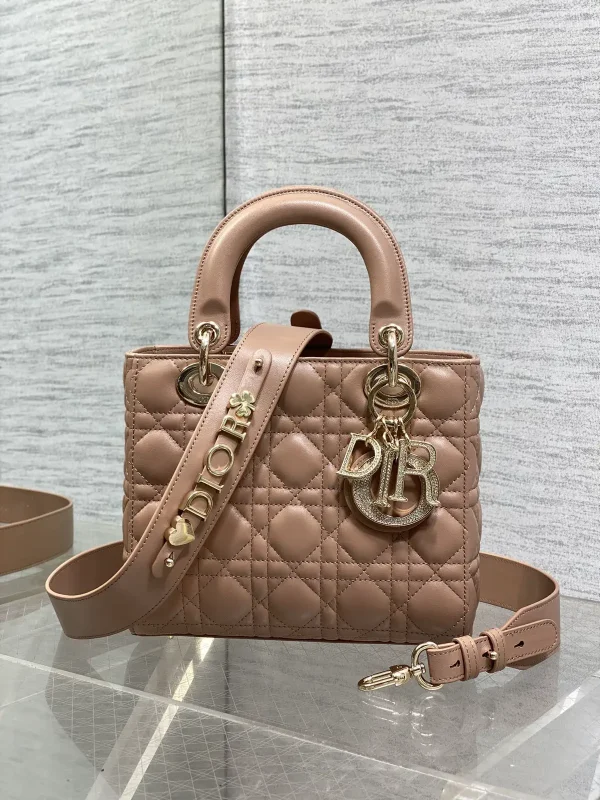 Dior Quilted Top Handle Bag with Decorative Charms image 1