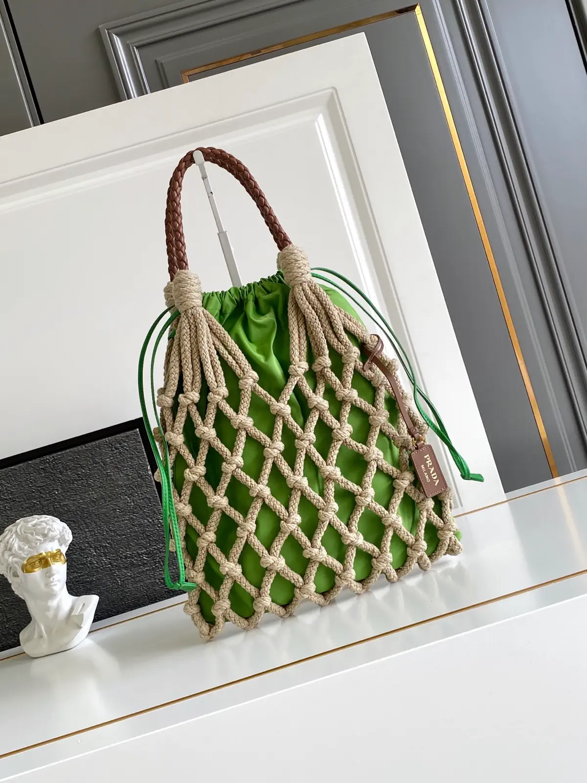 Prada Woven Net Drawstring Top Handle Bag image 1