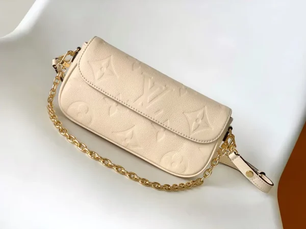 Louis Vuitton Cream Monogram Empreinte Wallet on Chain Ivy image 1