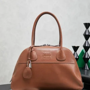Miu Miu Embossed Logo Top Handle Bag image 1