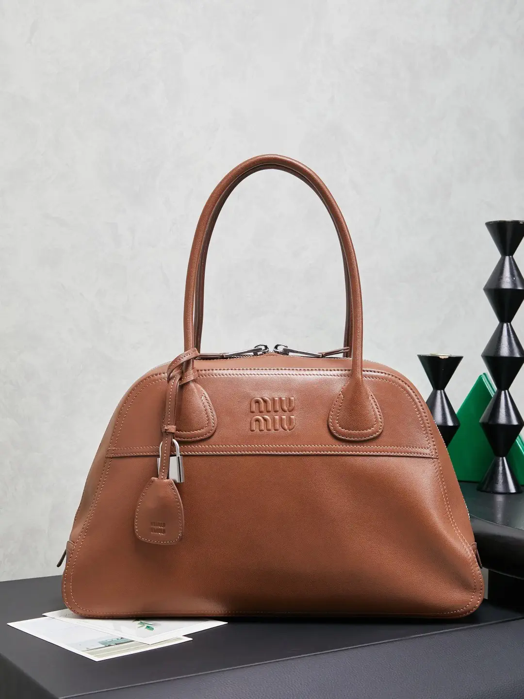 Miu Miu Embossed Logo Top Handle Bag image 1