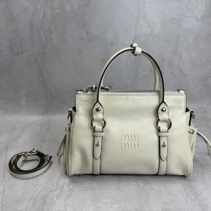 Miu Miu Embossed Logo Top Handle Crossbody Bag image 1