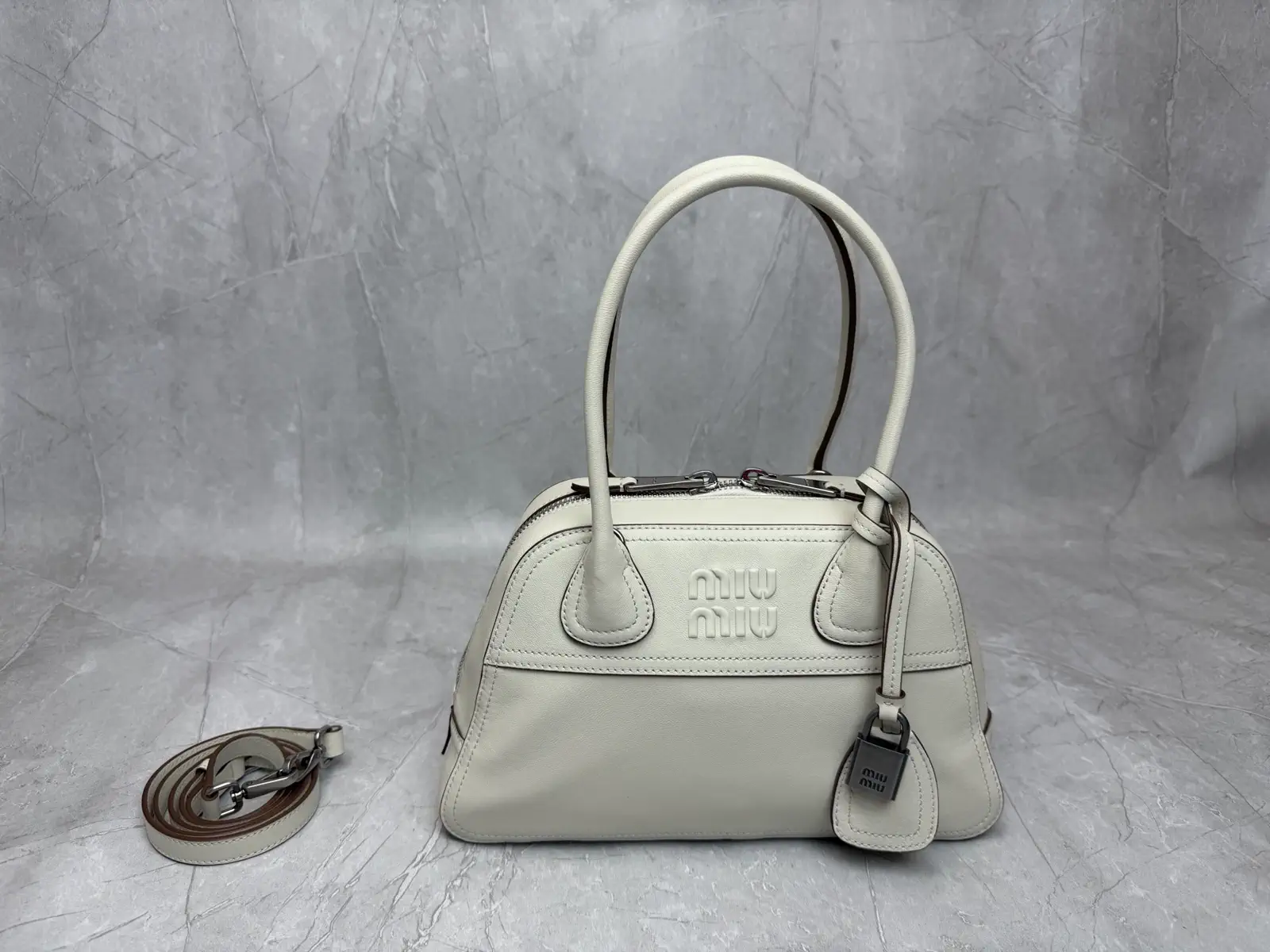 Miu Miu Embossed Logo Top Handle Bag image 1