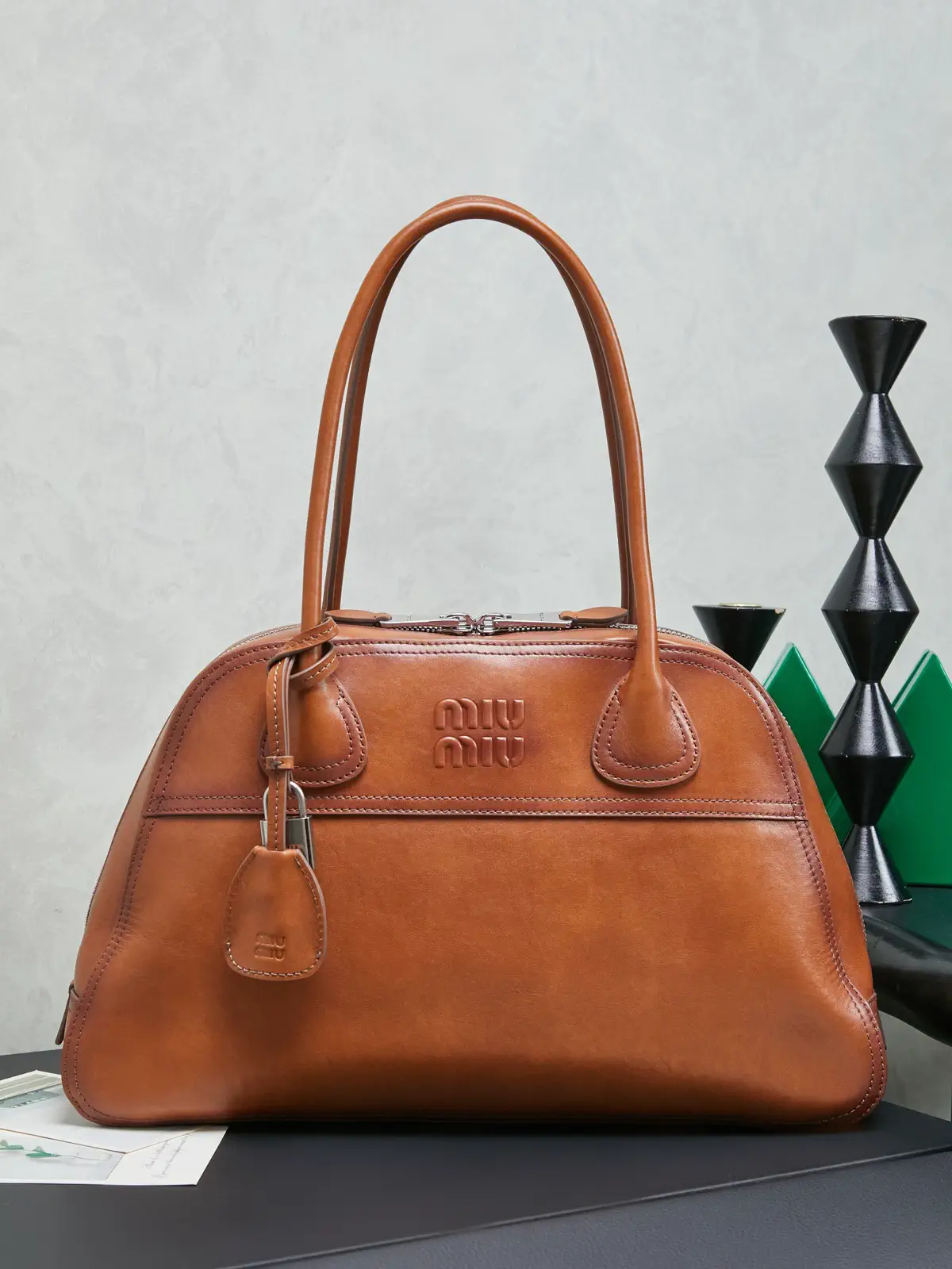Miu Miu Embossed Logo Leather Top Handle Bag image 1