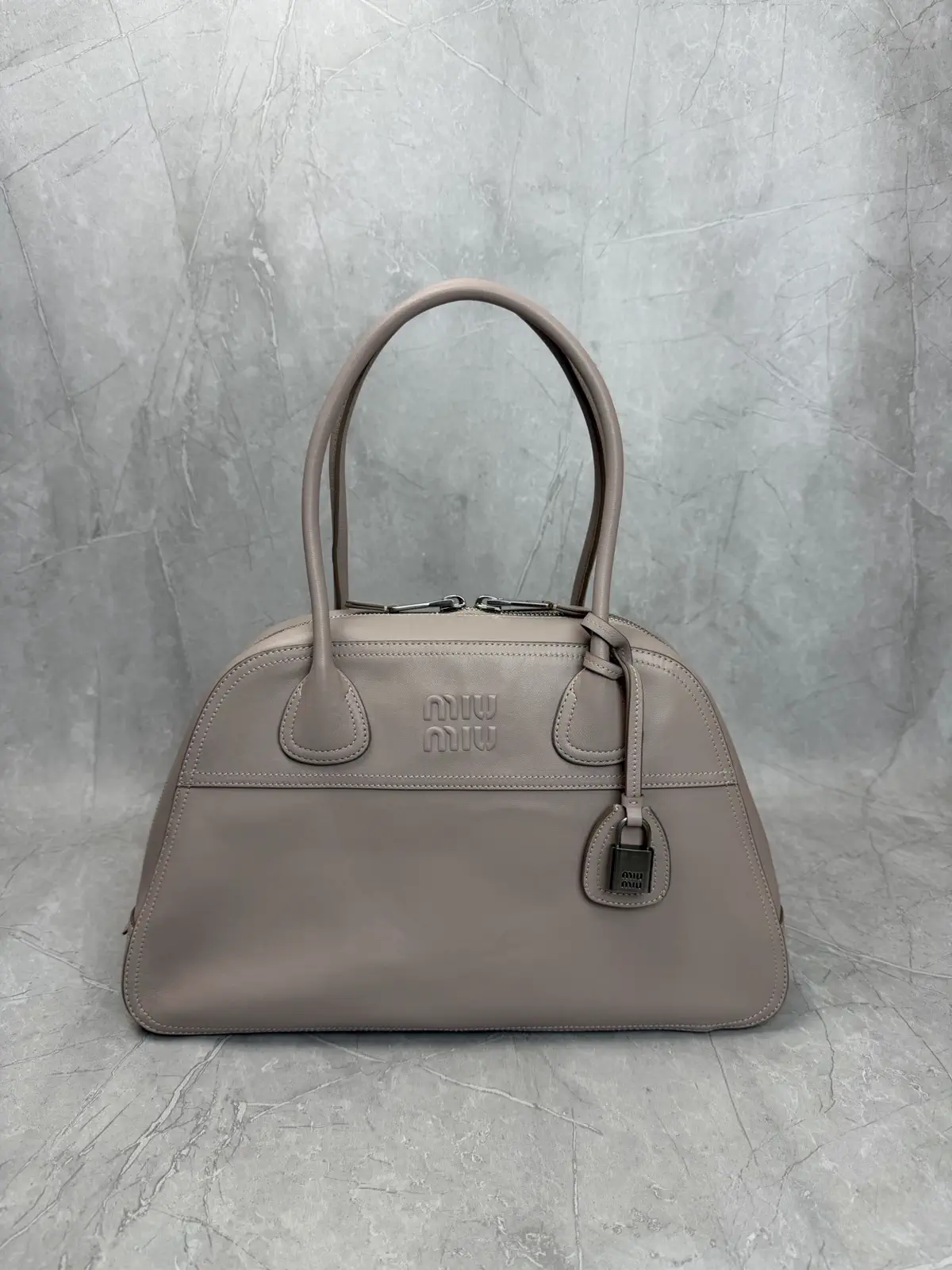 Miu Miu Embossed Logo Top Handle Bag image 1
