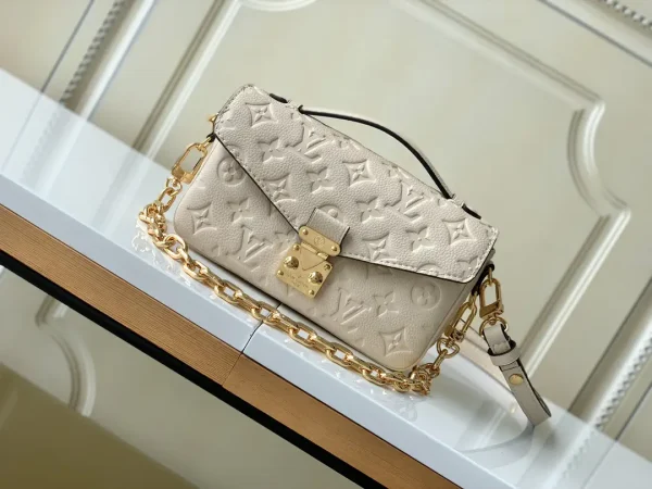 Louis Vuitton Cream Monogram Empreinte Pochette Métis East West Bag image 1