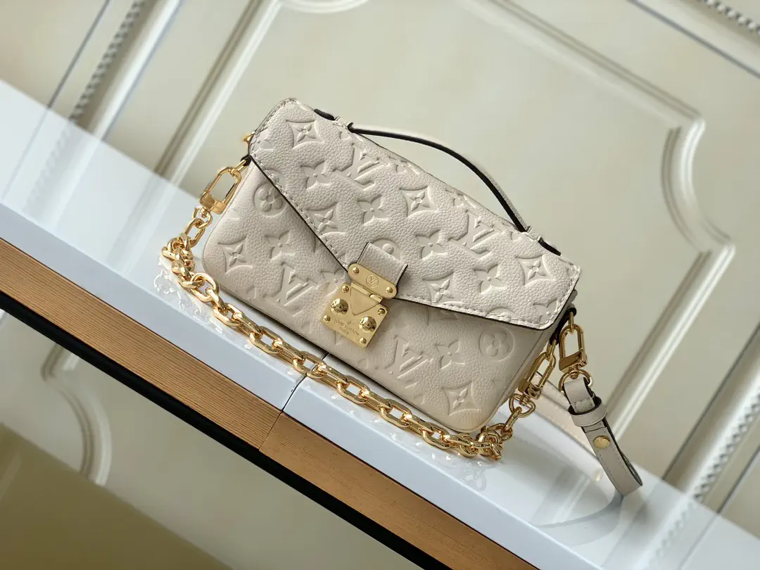 Louis Vuitton Cream Monogram Empreinte Pochette Métis East West Bag image 1