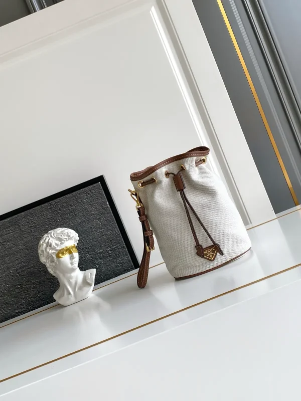 Prada Canvas Drawstring Bucket Bag with Leather Trim image 1