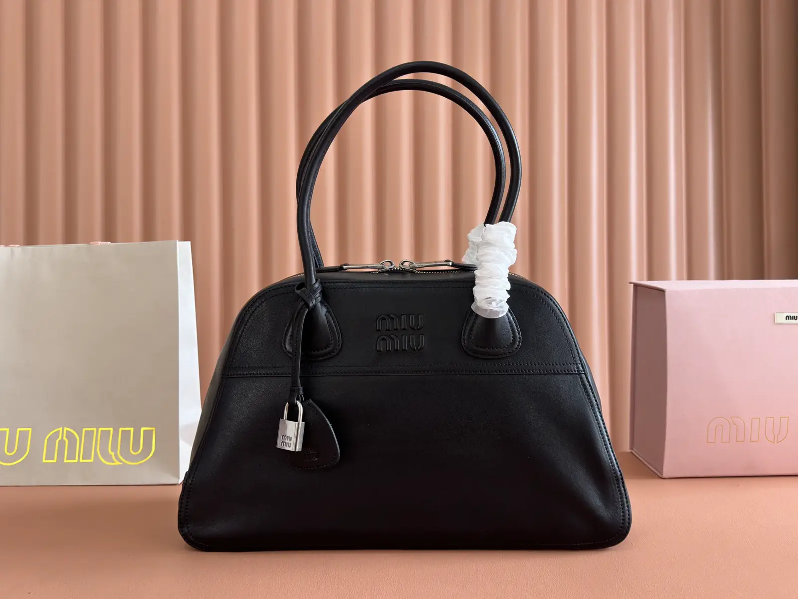 Miu Miu Embossed Logo Top Handle Bag image 1