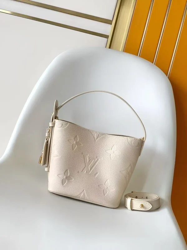 Louis Vuitton Cream Monogram Embossed Bucket Bag image 1