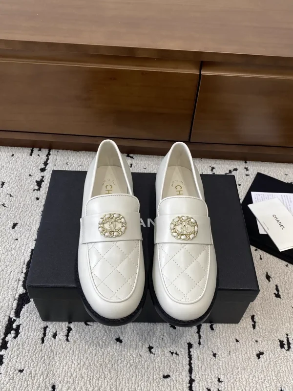 CHANEL White Quilted Loafers with Decorative CC Emblem image 1