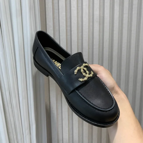CHANEL Black Leather Loafers with Gold Logo image 1