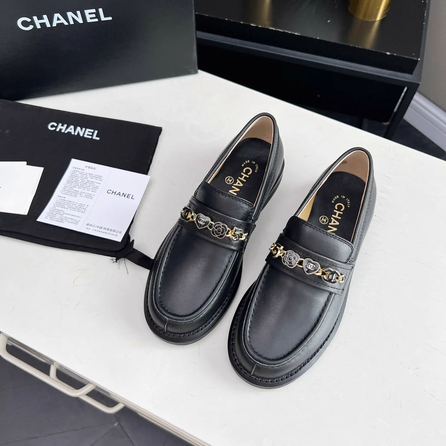 CHANEL Black Leather Loafers with Chain Detail image 1
