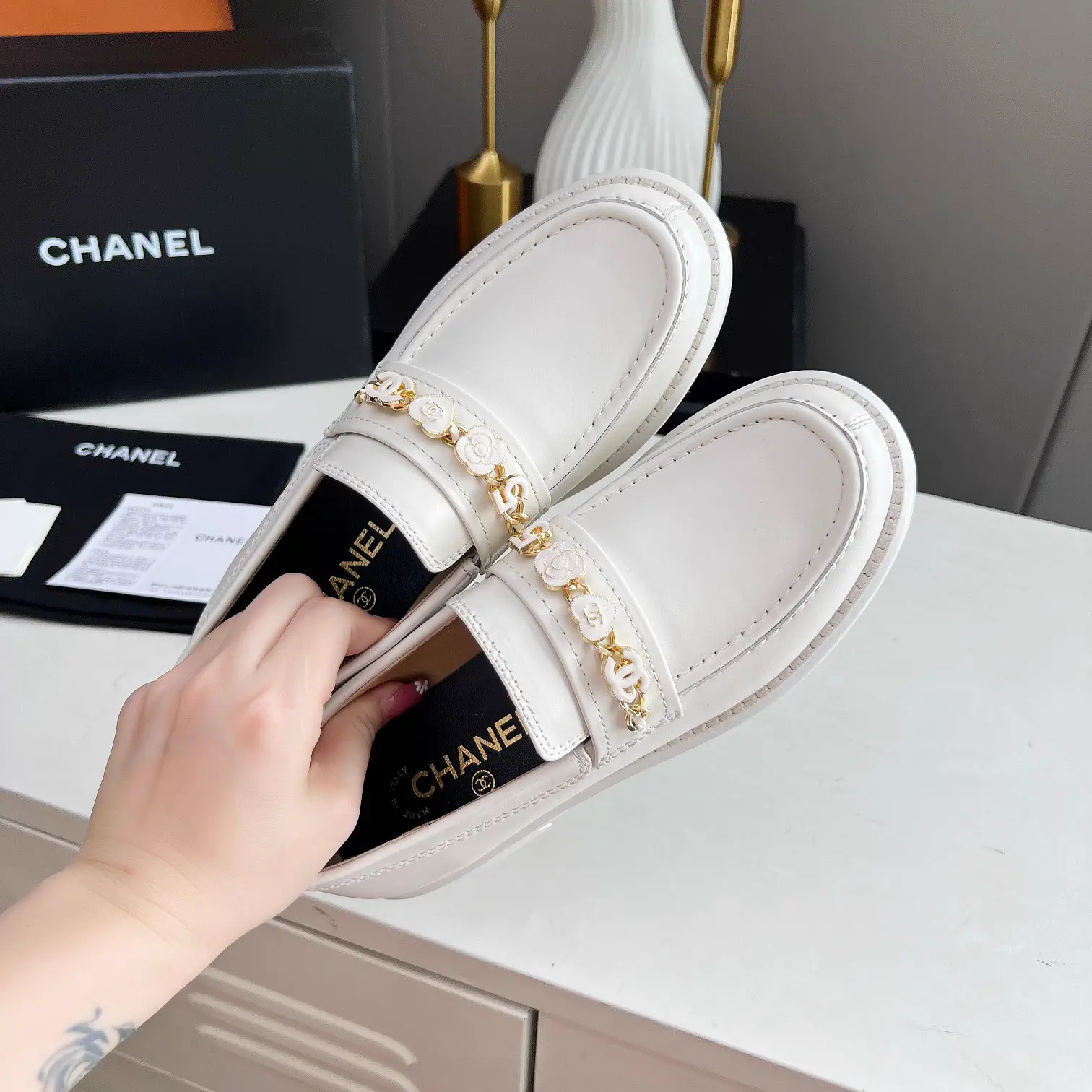 CHANEL White Leather Loafers with Decorative Chain image 1