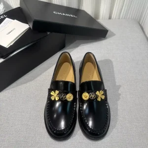 CHANEL Black Patent Leather Loafers with Gold Decorative Charms image 1