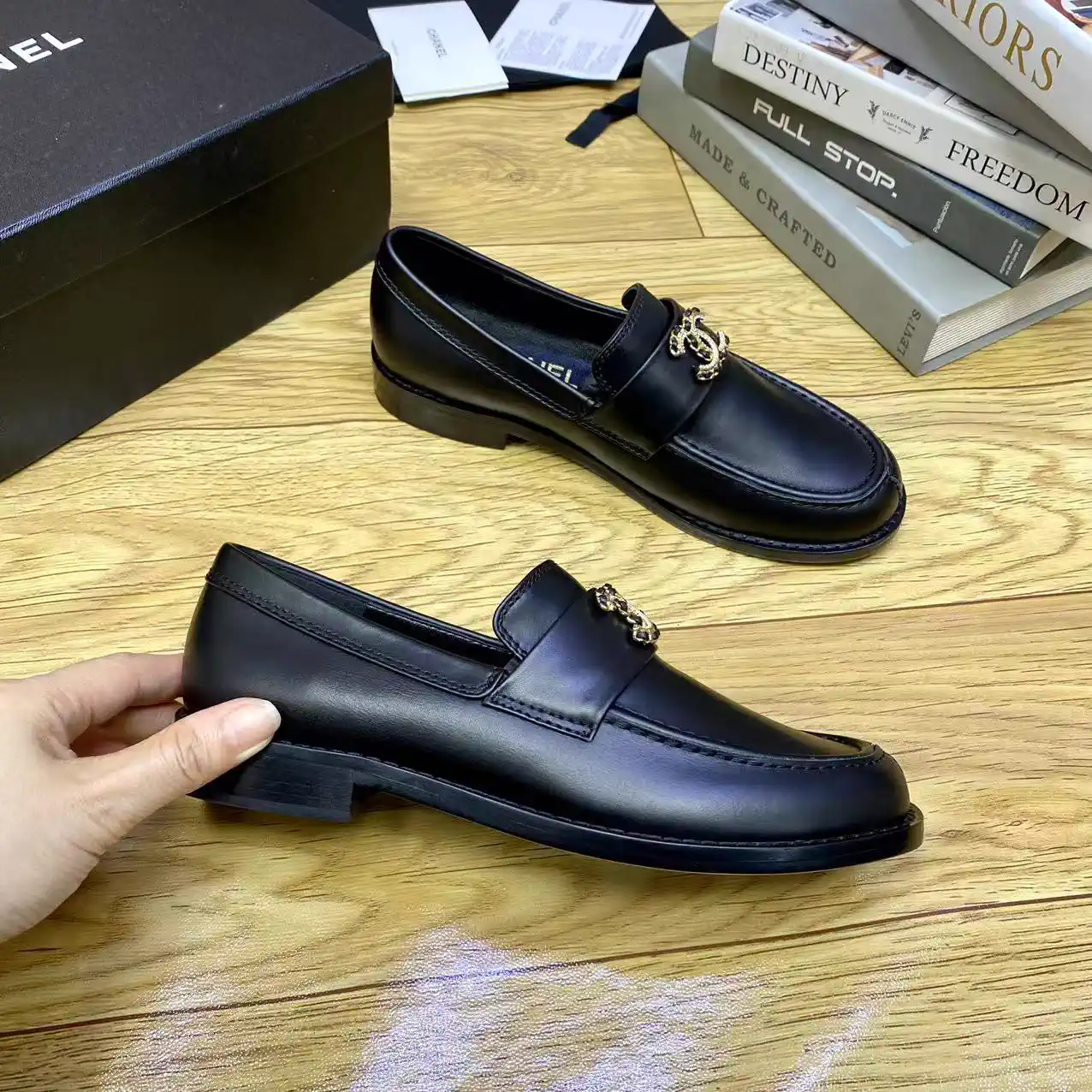 CHANEL Black Leather Loafers with Gold Logo Accent image 1