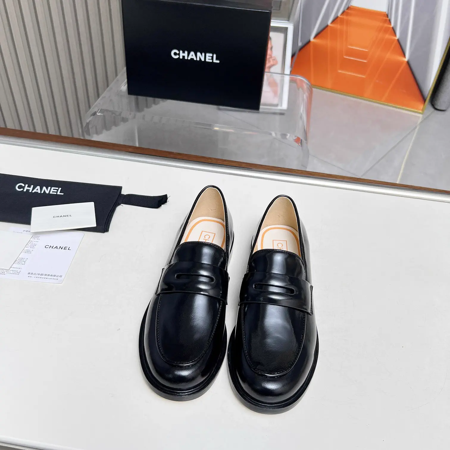 CHANEL Black Leather Penny Loafers image 1