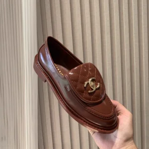 CHANEL Quilted Patent Leather Loafers with Gold-Tone Buckle image 1