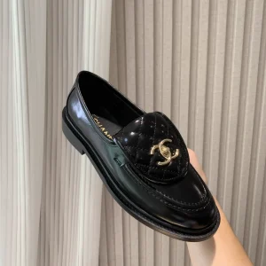 CHANEL Quilted Patent Leather Loafers with Gold-Tone Buckle image 1