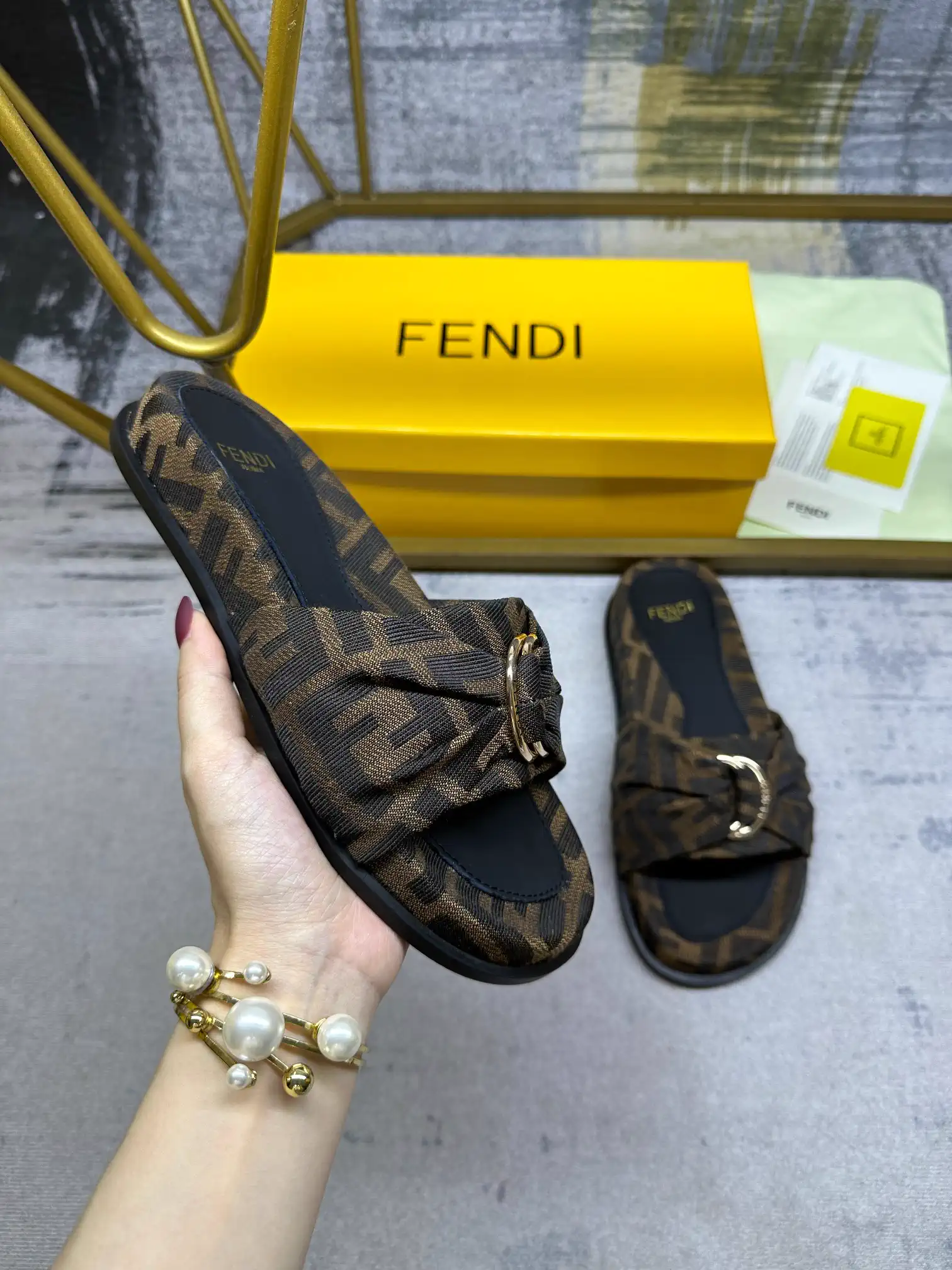 FENDI Flat Slide Sandals with Knotted Strap and Gold-Tone Hardware image 1