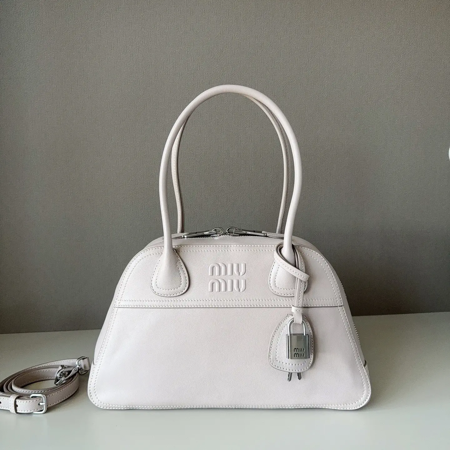 Miu Miu Embossed Logo Leather Top Handle Bag image 1