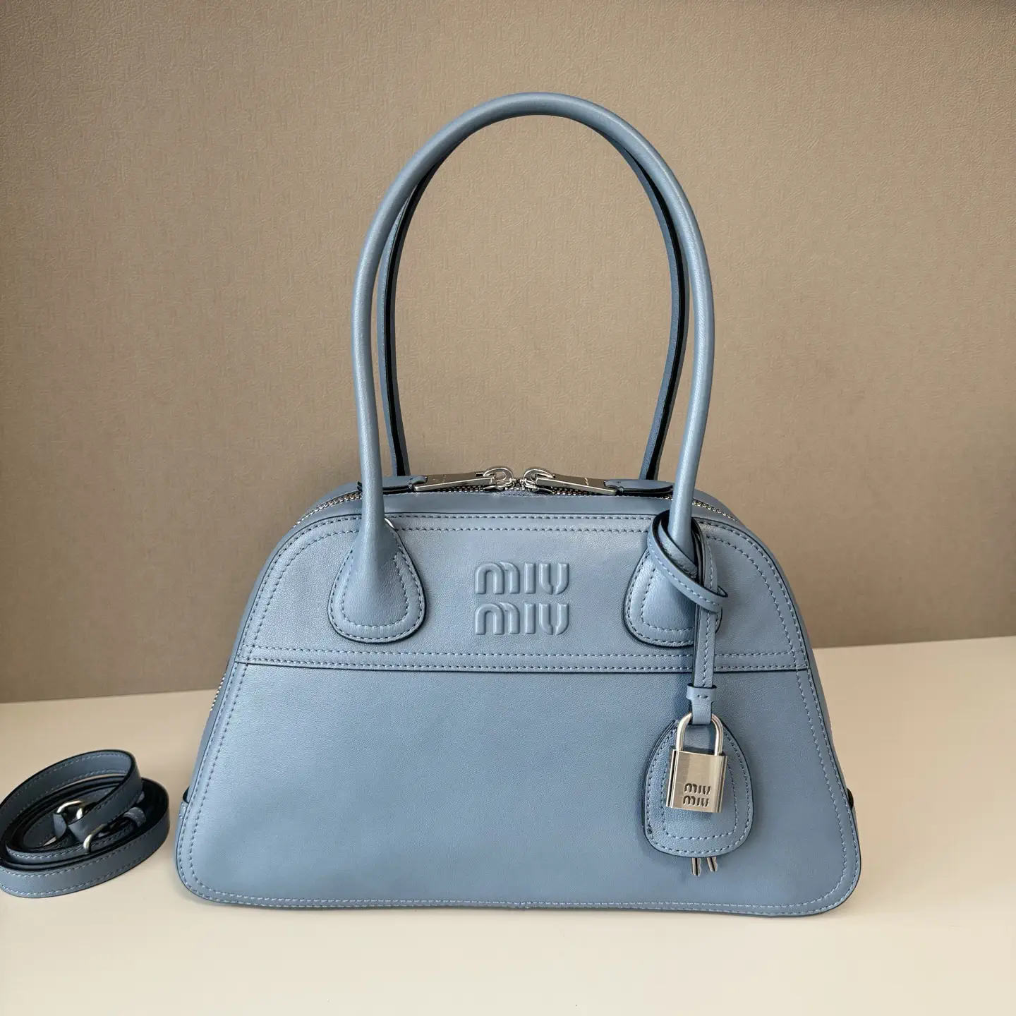 Miu Miu Embossed Logo Top Handle Bag image 1