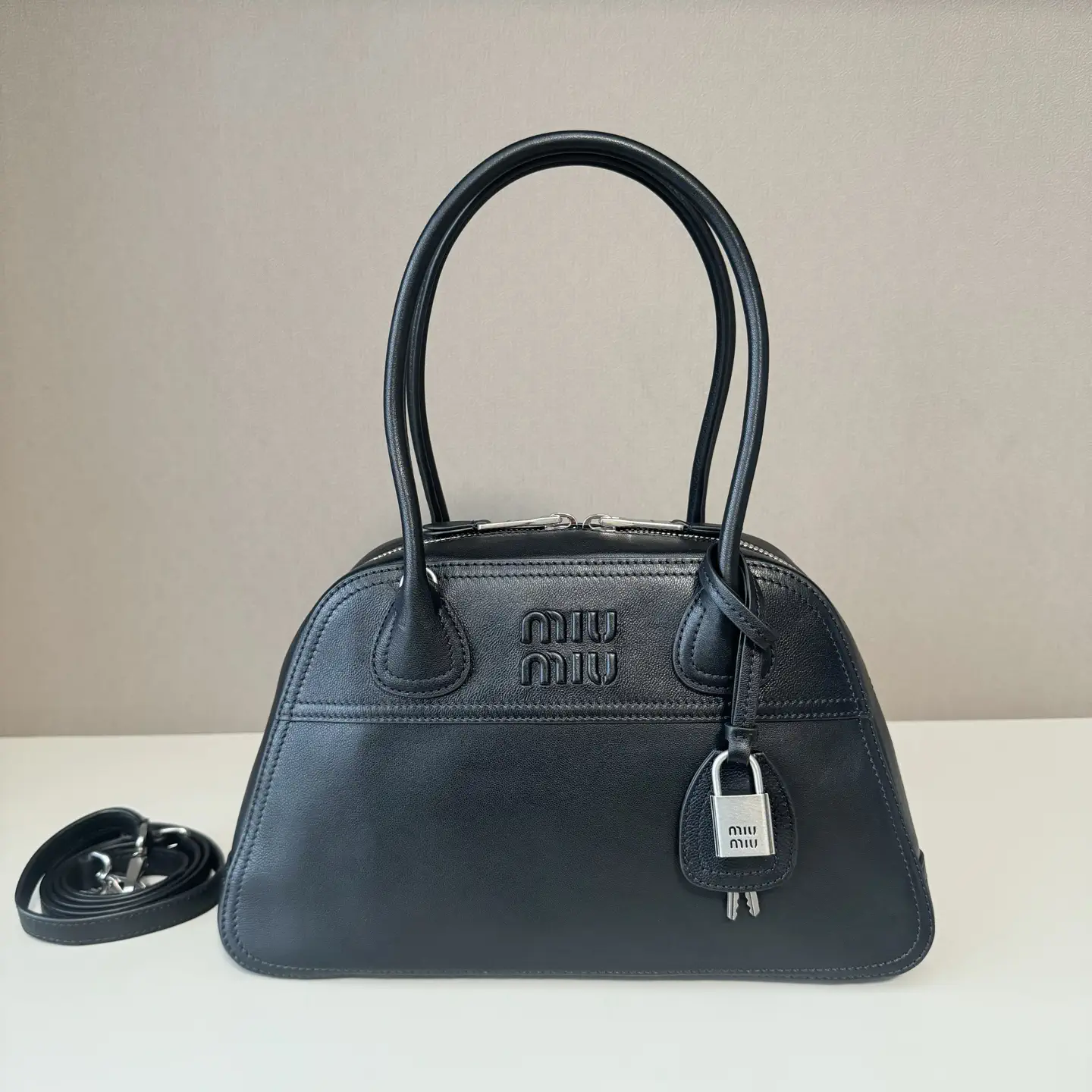 Miu Miu Embossed Logo Leather Top Handle Bag image 1