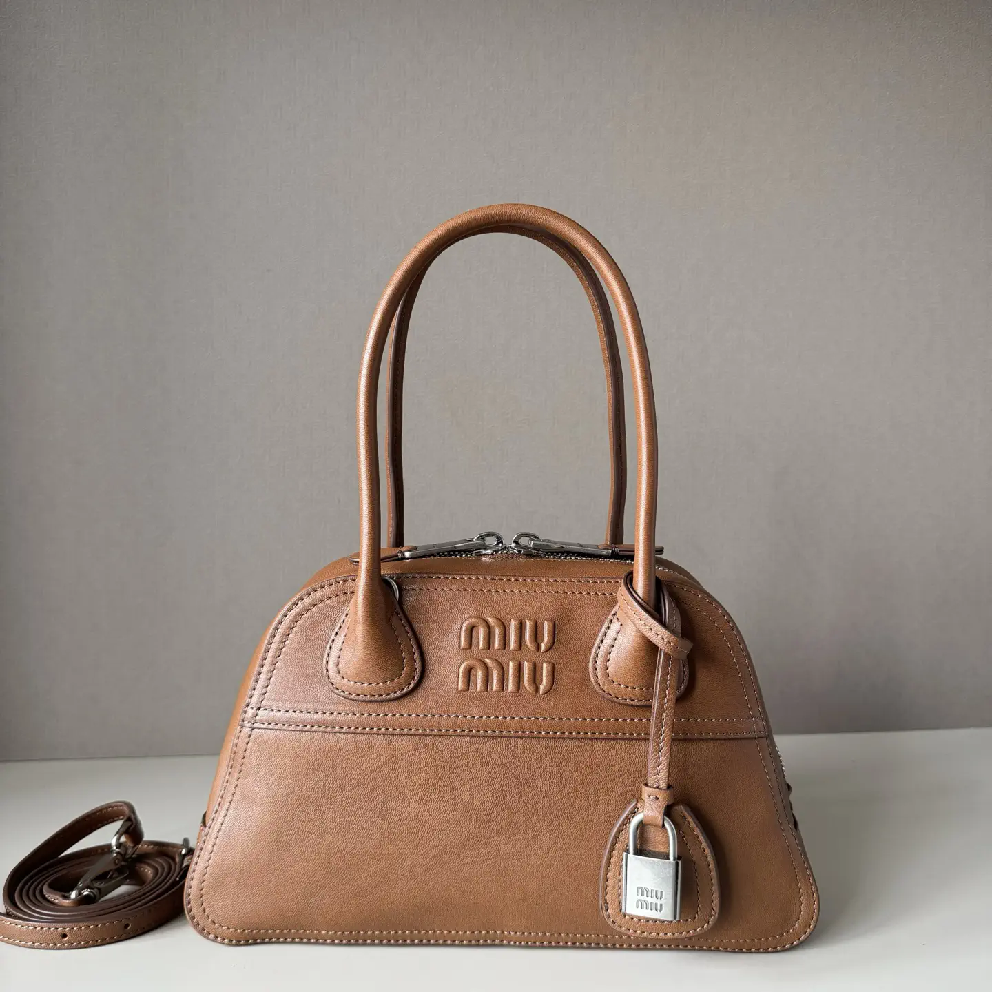 Miu Miu Embossed Logo Top Handle Bag image 1