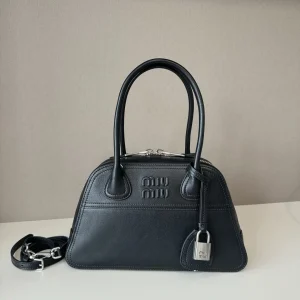 Miu Miu Embossed Logo Top Handle Bag image 1