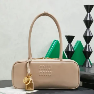 Miu Miu Beige Leather Top Handle Bag with Lock Charms image 1