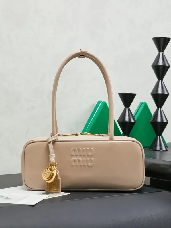 Miu Miu Beige Leather Top Handle Bag with Lock Charms image 1