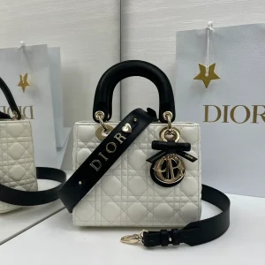 Dior White Quilted Top Handle Bag with Black Strap and Bow Charm image 1