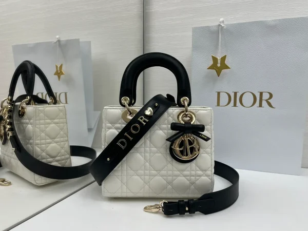 Dior White Quilted Top Handle Bag with Black Strap and Bow Charm image 1