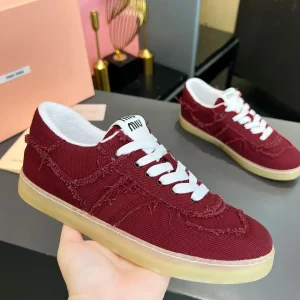 Miu Miu Vintage Distressed Fringed Canvas Sneakers image 1