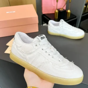 Miu Miu Vintage Distressed Fringed Canvas Sneakers image 1