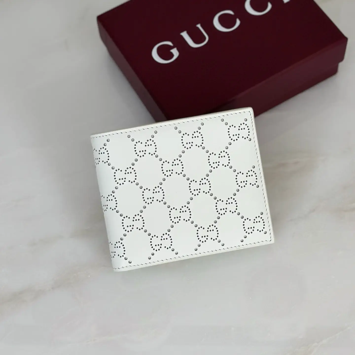 Gucci White Perforated GG Bifold Wallet image 1
