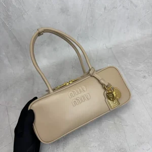 Miu Miu Beige Top Handle Bag with Lock Charms image 1
