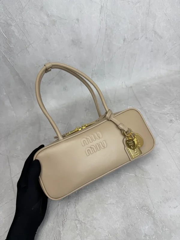 Miu Miu Beige Top Handle Bag with Lock Charms image 1