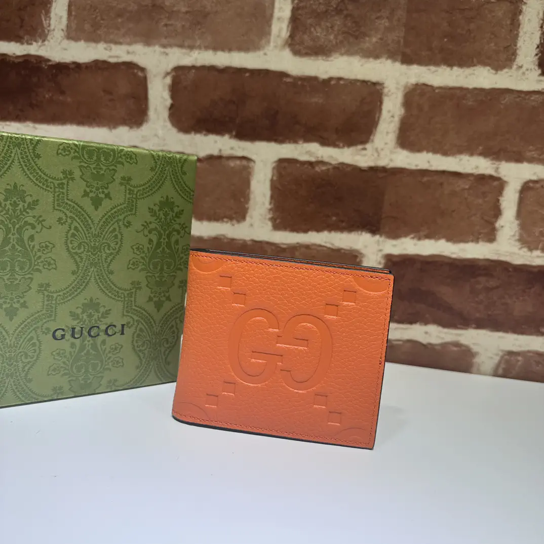 Gucci Orange Embossed GG Bifold Wallet image 1