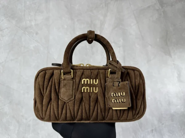 Miu Miu Quilted Suede Top Handle Bag image 1