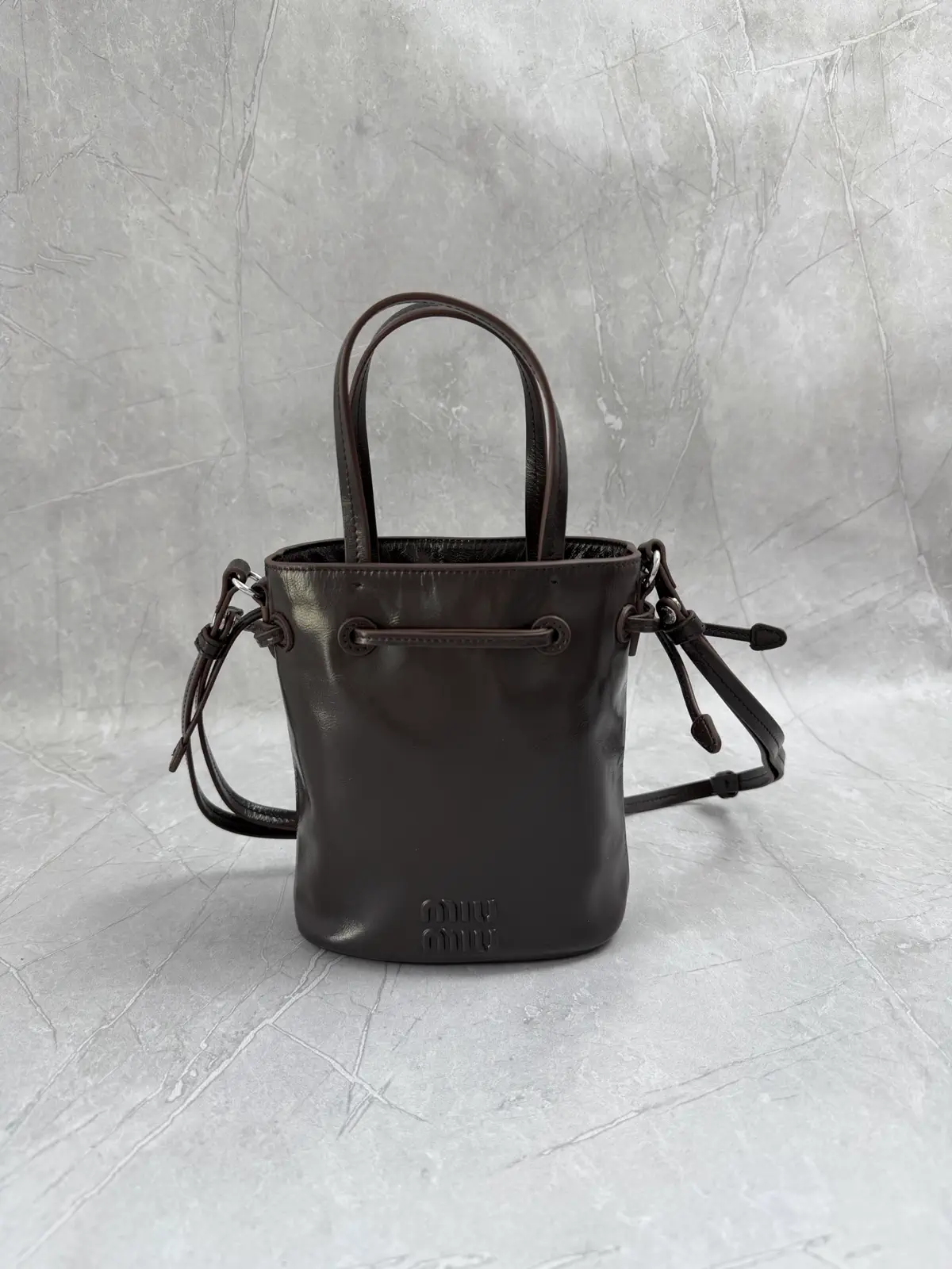 Miu Miu Embossed Logo Mini Bucket Bag image 1